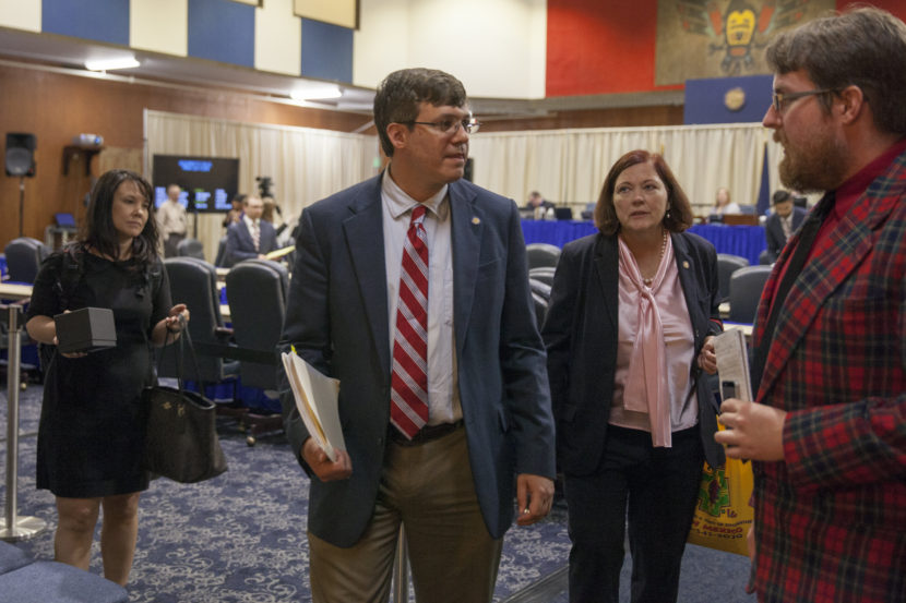 Sens. Anna MacKinnon, R-Eagle River and John Coghill, R-North Pole, chat during the fifth special session of Alaska's Legislature in the last two years on July 11, 2016 in Juneau, Alaska. (Photo by Rashah McChesney/KTOO)