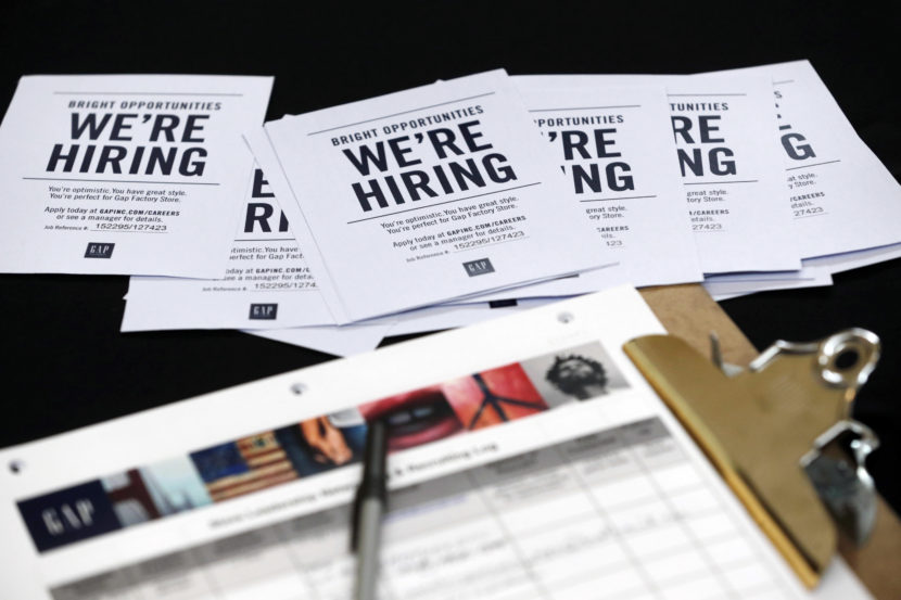 Job applications and information for the Gap Factory Store sit on a table during an October job fair at Dolphin Mall in Miami. (Photo by Wilfredo Lee/AP)