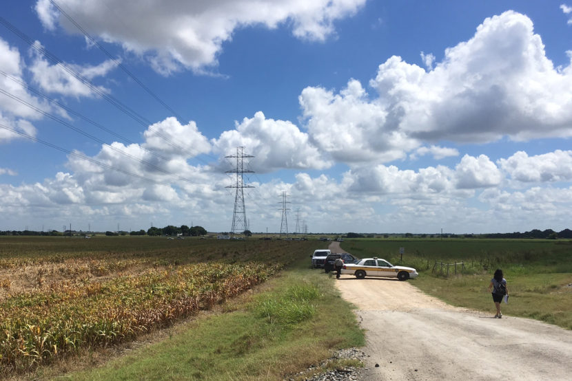 Police cars block access to the site where a hot air balloon crashed early Saturday in Central Texas. James Vertuno/AP