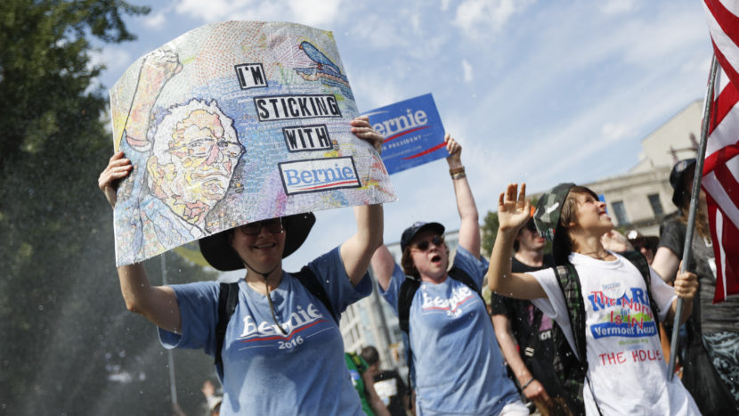 Supporters of Sen. Bernie Sanders, I-Vt., march during a protest in downtown Philadelphia on Sunday. (Photo by John Minchillo/AP)