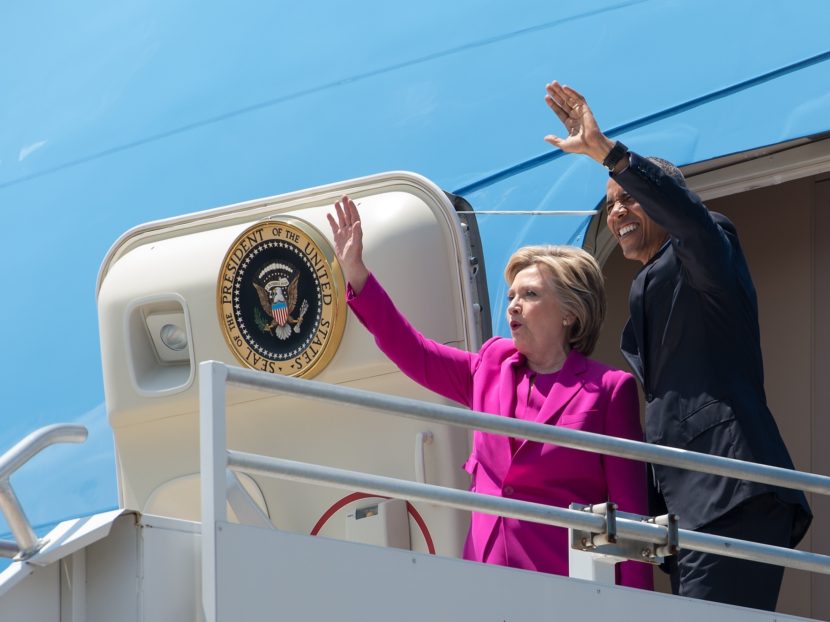 President Obama and Hillary Clinton walk off Air Force One in Charlotte, N.C., to attend a Clinton campaign event. The costs of that flight will be repaid by the Democratic National Committee. (Photo by Nicholas Kamm/AFP/Getty Images)