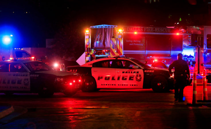 Dallas police work near the scene where Dallas police officers were shot at the end of a protest being held in downtown Dallas in response to recent fatal shootings of two black men by police. (Photo by Ron Jenkins/Getty Images)