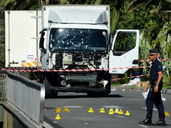 Forensic police investigate a truck at the scene of a terror attack on the Promenade des Anglais on Thursday evening in Nice, France. A French-Tunisian attacker killed 84 people as he drove a truck through crowds gathered to watch a fireworks display during Bastille Day celebrations.(Photo by The Asahi Shimbun via Getty Images)