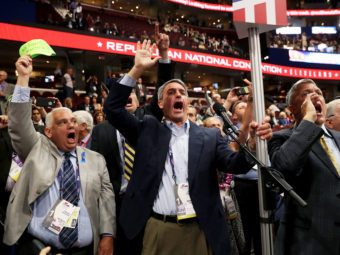 Former Virginia Attorney General Ken Cuccinelli (left) along with other delegates from Virginia chants for a roll call vote on Monday, the first day of the Republican National Convention, at the Quicken Loans Arena in Cleveland. (Photo by John Moore/Getty Images)