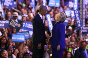 President Obama and Hillary Clinton stand together on stage on the third day of the Democratic National Convention in Philadelphia