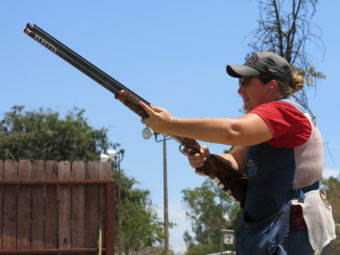Kim Rhode takes practice shots with the assist of her father Richard Rhode, who's been her coach for 27 years. Nathan Rott