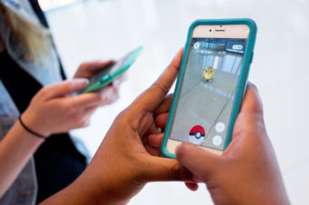 The mobile app Pokémon Go is currently the top downloaded free app in both Apple and Android stores. The augmented reality game allows smartphone users to track and catch Pokémon in real life. (Photo by Ruby Wallau/NPR)