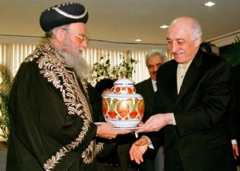 Muslim cleric Fetullah Gulen (right) receives a vase from Israel's Chief Rabbi Eliyahu Bakshi Doron during a meeting in Istanbul, Turkey, in 1998. Turkey's President Recep Tayyip Erdogan on Saturday accused Gulen of involvement in a coup attempt, a charge Gulen denied. MURAD SEZER/AP