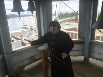 Deacon Herman Madsen plays the bells atop St. Michael’s Cathedral. (Katherine Rose, KCAW)
