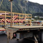 Workers from North Pacific Erectors Inc. of Douglas install a new sign at Foodland IGA in downtown Juneau. Store director Rick Wilson said the installation should be completed Tuesday afternoon. (Photo by Tripp J Crouse/KTOO)