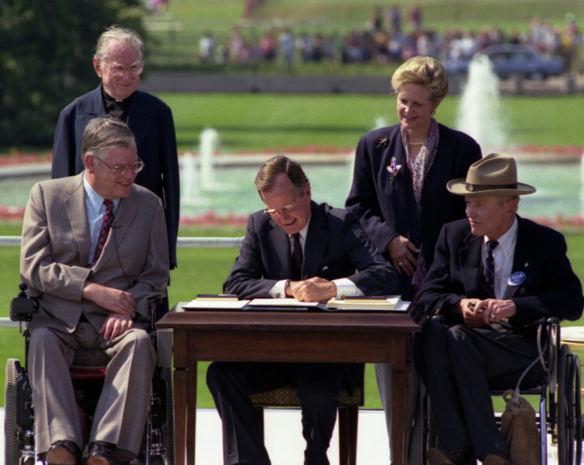 President George H.W. Bush signs Americans with Disabilities Act