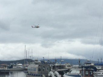 USCG helicopter flying near Don D. Statter Harbor in Auke Bay on Sunday, Aug. 14, 2016. (Photo by Quinton Chandler/KTOO)