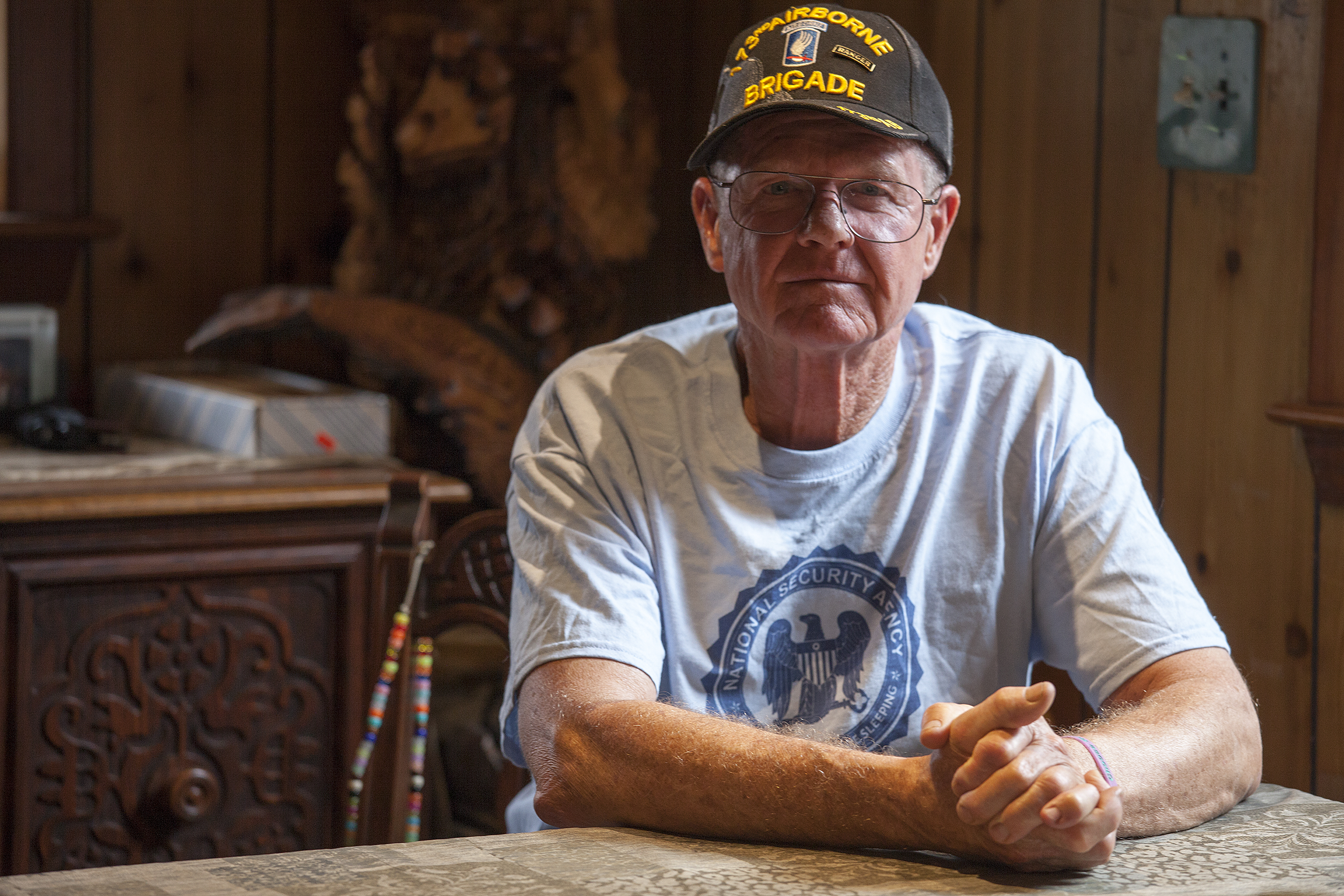 John Suter sits in his dining room in Chugiak. His appeal with the Ombudsman's Office has been ongoing for more than a decade. (Photo by Rashah McChesney/ KTOO)