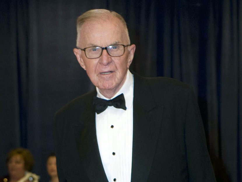 John McLaughlin arrives at the 2012 White House Correspondents' Association Dinner in Washington D.C. McLaughlin, the conservative host of The McLaughlin Group television show that pioneered hollering-heads discussions of Washington politics died at the age of 89. (Kevin Wolf, Associated Press)