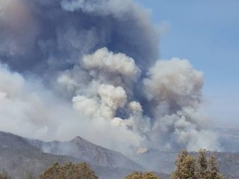 Ten thousand fire personnel are battling blazes across California, including in San Luis Obispo County, where the massive Chimney Fire threatens homes and the historic Hearst Castle. (Associated Press)