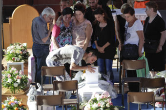 Relatives mourn over a coffin of one of the earthquake victims prior to the start of the funeral service on Saturday in Ascoli Piceno, Italy. Gregorio Borgia/AP