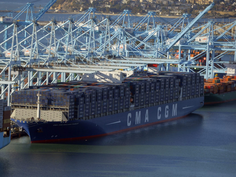 After its maiden voyage from China, the largest container ship to ever make port in North America, unloads its cargo in the Port of Los Angeles on Dec. 26, 2015. The major shipping companies in Europe and Asia began ordering the state-of-the-art, supersized ships back in 2011, when times were better. Scott Varley/AP