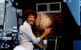Ross filmed more than 400 episodes of The Joy of Painting. He actually painted three different versions of each work for every show — but viewers only saw the one on screen. (File photo by Bob Ross Inc.)