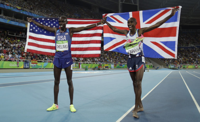 American Paul Chelimo (left), a member of the U.S. Army, celebrates his silver medal in the men's 5,000 meters along with the winner, Mo Farah of Britain. Chelimo was disqualified shortly afterward, but his second-place finish was later reinstated. Matt Slocum/AP