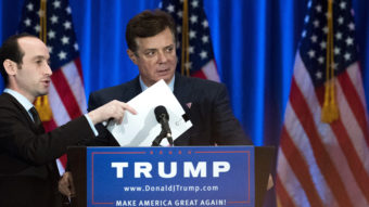 Campaign chairman Paul Manafort checks the podium before Donald Trump speaks during a June event at Trump SoHo Hotel. (Photo by Drew Angerer/Getty Images)