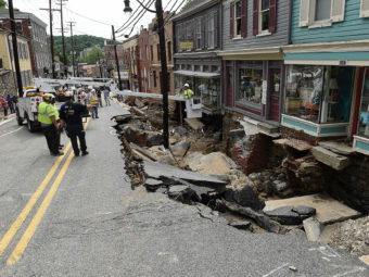 Rescue workers on Sunday look at the destruction caused by a flash flood on Main Street in Ellicott City, Md. The Washington Post/Getty Images