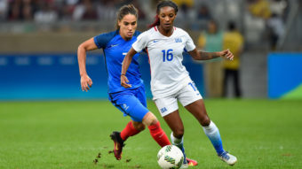 U.S. women's soccer player Crystal Dunn (in white) contends with Amel Majri of France during their match at Mineirao Stadium in Belo Horizonte, Brazil. The U.S. earned a 1-0 victory in the the Group G first-round meeting in the Rio Summer Olympics tournament. Pedro Vilela/Getty Images