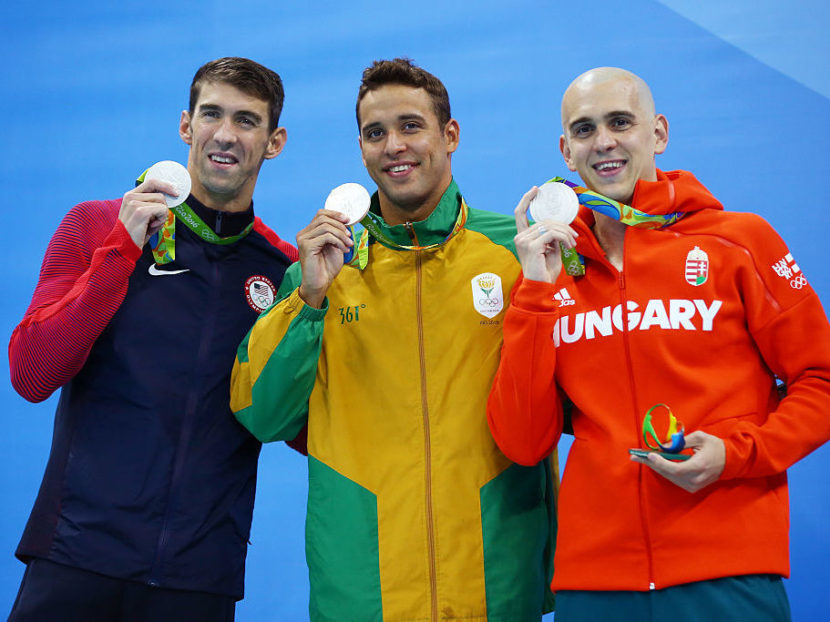 Joint silver medalists, (R-L) Michael Phelps of United States, Chad Guy Bertrand le Clos of South Africa and Laszlo Cseh of Hungary celebrate winning silver in the Men's 100m Butterfly Final on Day 7 of the Rio 2016 Olympic Games at the Olympic Aquatics Stadium on August 12, 2016 in Rio de Janeiro, Brazil. Clive Rose/Getty Images