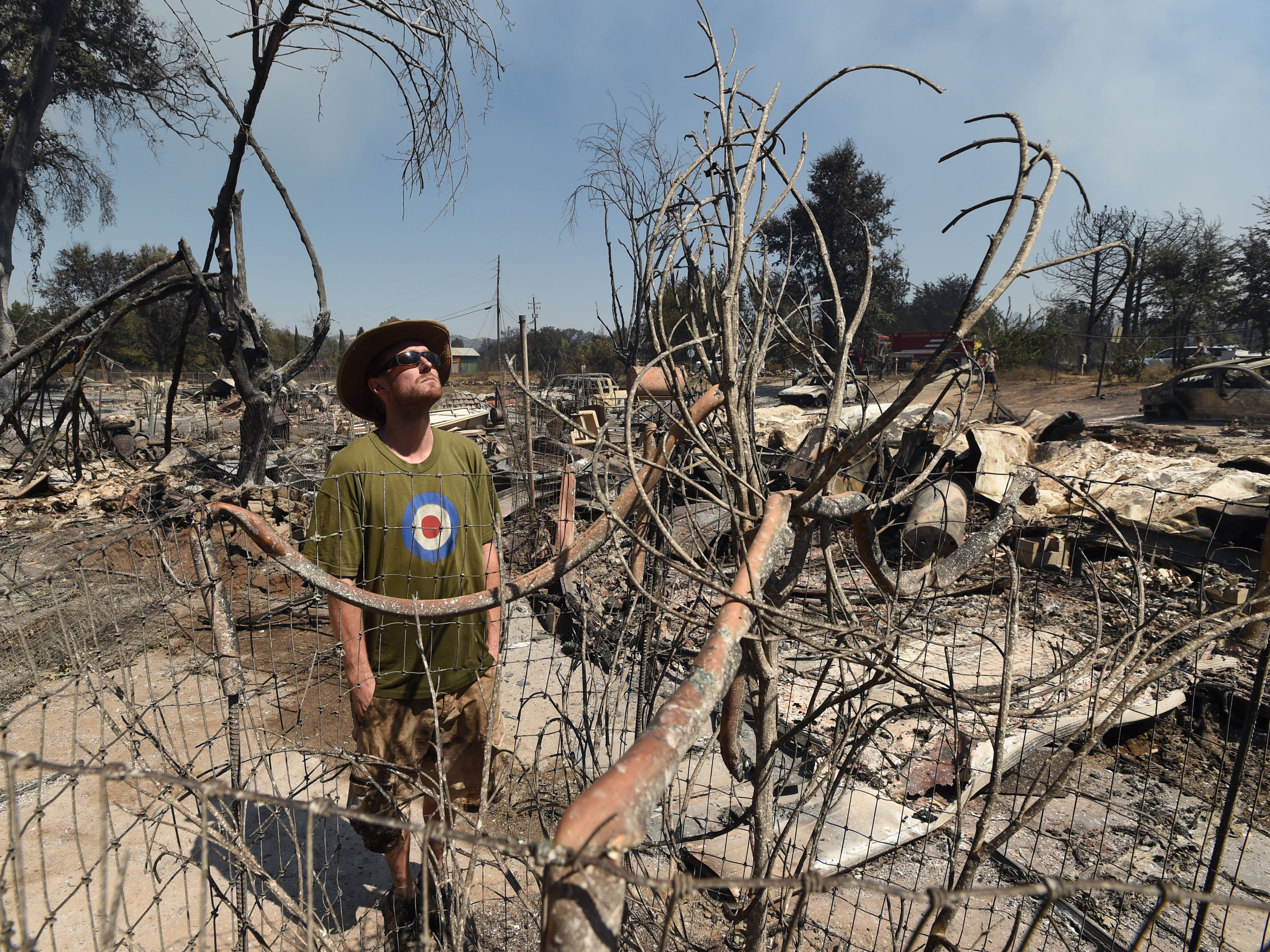 James McCauley looks over the burned-out remains of his residence in the town of Lower Lake, Calif. (Josh Edelson, Associated Press)