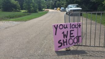 A handmade sign offers a stern warning at the entrance to an abandoned neighborhood where people have lost so much. (Kirk Siegler/NPR)