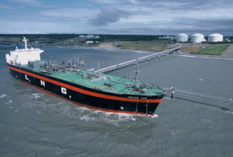 An LNG tanker fills up at the ConocoPhillips liquid natural gas export facility in Nikiski, Alaska. When it opened in 1969, it was the only facility of its kind in the U.S. to get a license to export its gas to Japan. For more than forty years, the state has attempted to develop similar projects to bring natural gas from the North Slope to market, none of those projects have broken ground. (Photo courtesy of ConocoPhillips)