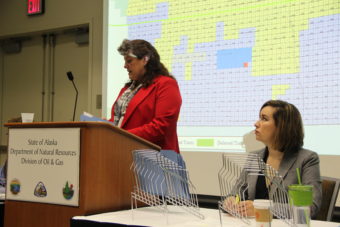 Corri Feige of DNR’s Division of Oil and Gas reads out bids during the state’s annual North Slope lease sale. (Photo: Rachel Waldholz/Alaska's Energy Desk)