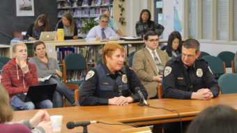 JPD Lt. Kris Sell (left) and Chief Bryce Johnson (right) speak at Tuesday's Juneau School Board meeting. (Photo by Quinton Chandler/KTOO)