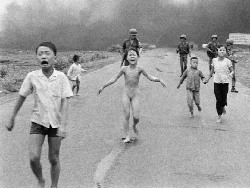 South Vietnamese forces follow terrified children, including 9-year-old Kim Phuc (center), as they run down Route 1 near Trang Bang after an aerial napalm attack on suspected Viet Cong hiding places, June 8, 1972. Nick Ut/AP