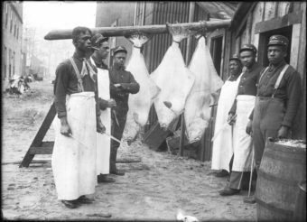 Buffalo Soldiers in Dyea prepare halibut for a fresh meal for their army unit. (Photo courtesy of the Alaskan State Library ASL- P226-868)