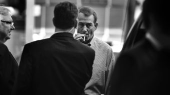 John Boehner smokes a cigarette after a news conference outside of Tart Lumber Company in Sterling, Va., in 2010. (Photo by Tom Williams/Roll Call Photos/Getty Images)