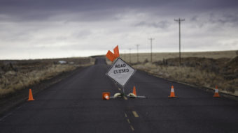 A sign is placed on a closed road to the Malheur National Wildlife Refuge near Burns, Ore., on Jan. 29, during the armed occupation of the refuge. (Photo by Rob Kerr/AFP/Getty Images)
