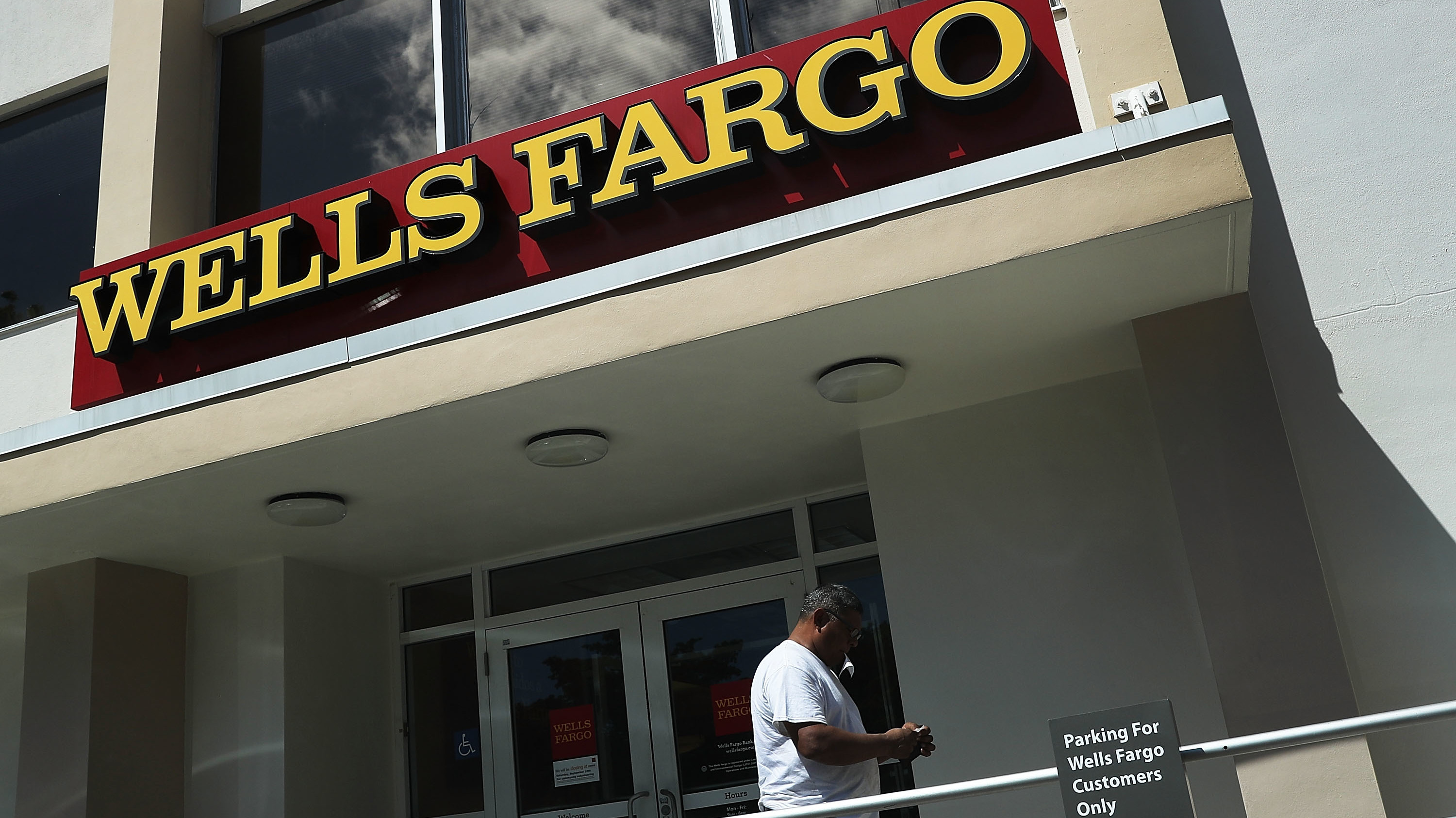 A Wells Fargo executive's departure with large stock and options holdings has sparked questions, after the division she ran incurred $185 million in penalties. (Photo by Joe Raedle/Getty Images)