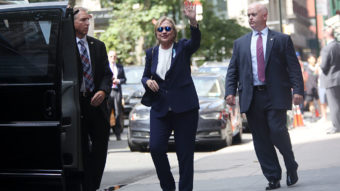 Hillary Clinton exits her daughter Chelsea Clinton's apartment on Sunday after she became sick at a Sept. 11 memorial service. Diagnosed with pneumonia, she had taken several days off the campaign trail to recover. (Photo by Yana Paskova/The Washington Post/Getty Images)
