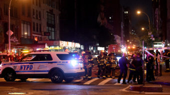 Police officers and firefighters respond to an explosion on Saturday at 23rd Street and 7th Avenue in the Chelsea neighborhood of New York City. Authorities say more than two dozen people have been taken to hospitals with injuries, none of which are thought to be life threatening. Jamie McCarthy/Getty Images