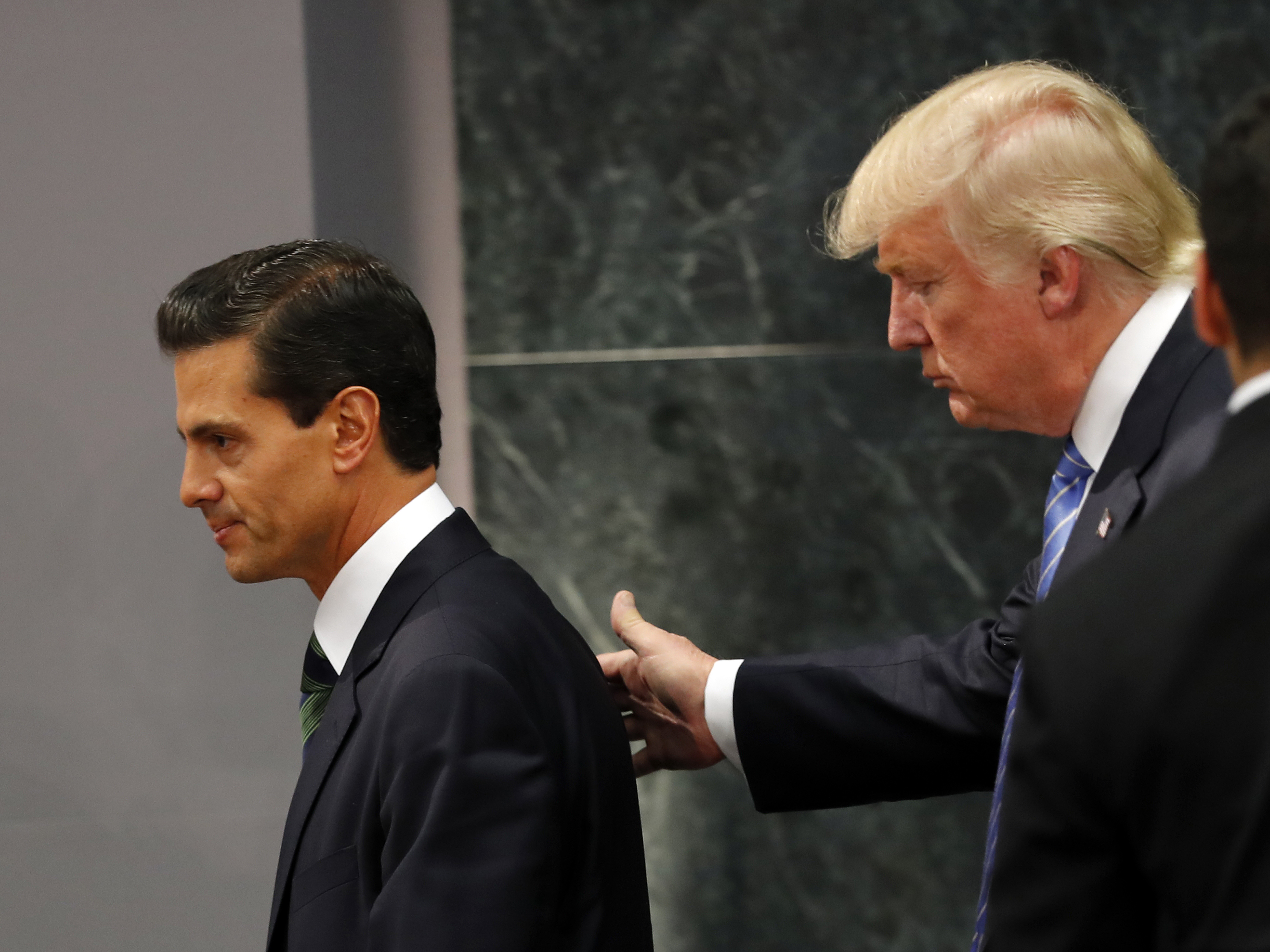 Republican presidential nominee Donald Trump walks with Mexico President Enrique Peña Nieto at the end of their joint statement at Los Pinos, the presidential residence, in Mexico City. (Photo by Dario Lopez-Mills/Associated Press)