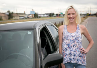 Abby McLean of Northglenn, Colo., stands near the stretch of U.S. 85 in Adams County where she was pulled over for a DUI check in September 2014. (Photo by Nathaniel Minor/CPR News)