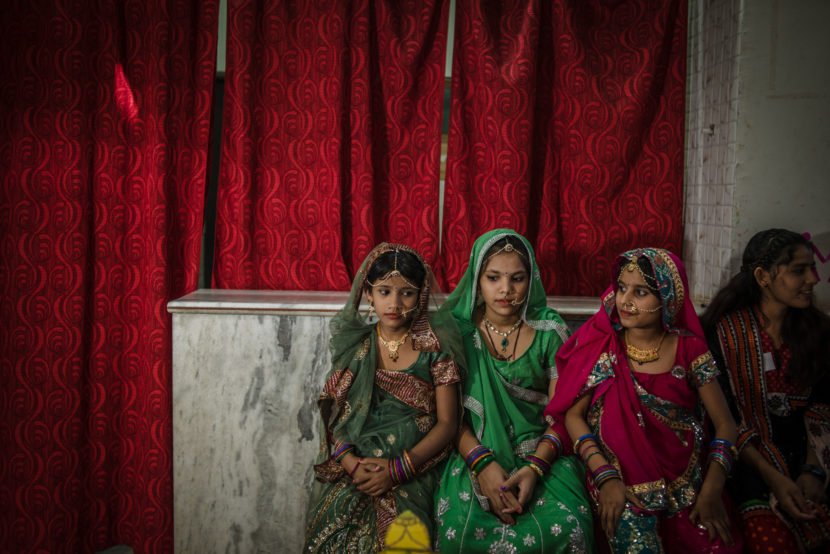 Three students from the Veerni Institute are dressed up for a dance performance in honor of their teachers. Nearly half of the girls at the Institute were married as children. Poulomi Basu for NPR