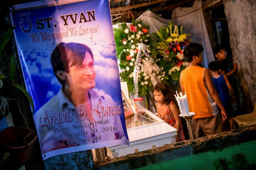 The wake for Aristotle Garcia, a suspected drug dealer shot by the police during an operation. Garcia's relatives believe he was not a dealer, but a drug user who was set up. (Photo by Alecs Ongcal for NPR)