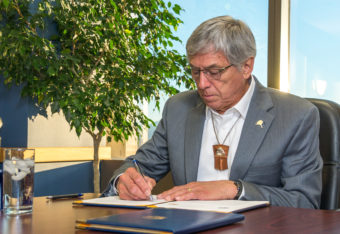 Lt. Gov. Byron Mallott signs a statement of cooperation with British Columbia Thursday. It targets protecting transboundary rivers. (Photo courtesy Office of the Governor)