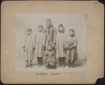 Handwritten on the back of this image: Pupils from Alaska AS THEY ARRIVED AT CARLISLE IN THE FALL OF 1897 SEE REDMAN, JUNE 1899. (Public Domain image from National Archives and Records Administration)