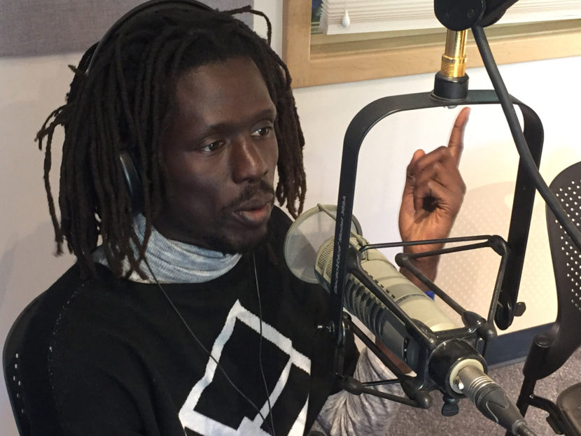 Emmanauel Jal talks about his transition from child soldier in Sudan to peace activist and hip hop artist during an interview on Tuesday.