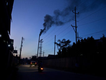 The smokestack of a factory on the outskirts of Gauhati, India, on Sunday. Anupam Nath/AP