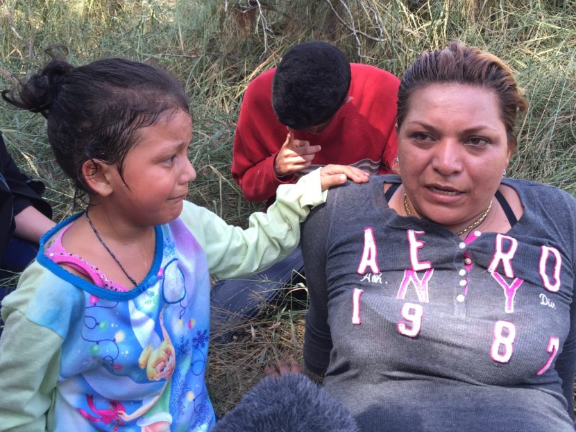 The Border Patrol apprehends a Salvadoran mother and her frightened daughter with a group of seven Central Americans down by the Rio Grande. John Burnett/NPR