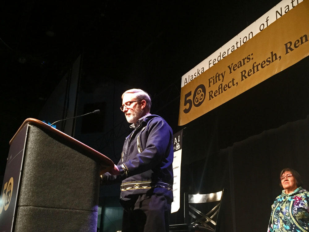 The Presbyterian Church's Curt Karns read an apology before hundreds gathered for the Alaska Federation of Natives Convention in Fairbanks, Alaska. (Photo by Emily Schwing/Northwest News Network)
