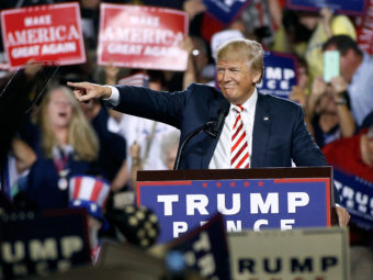 Republican presidential nominee Donald Trump points out to the crowd of supporters as he arrives at a campaign rally on Oct. 4, 2016 in Prescott Valley, Arizona. Ralph Freso/Getty Images